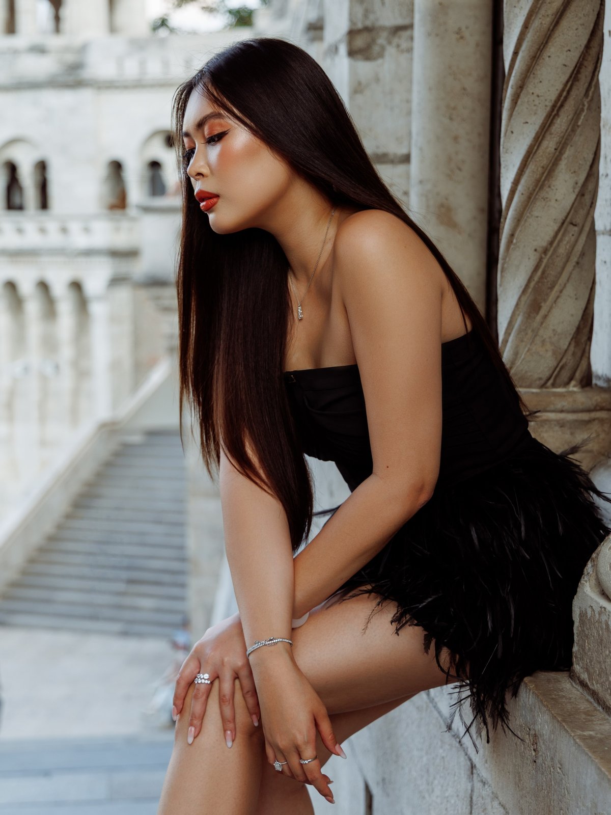 Editorial make-up at Fisherman's Bastion Budapest — cat-eye liner and coral lip